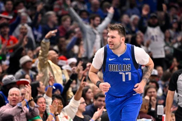 Dallas Mavericks guard Luka Do<em></em>ncic (77) celebrates after making a basket against the Minnesota Timberwolves during the first quarter at the American Airlines Center.