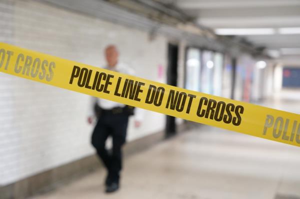 A picture showing police tape at the fire scene.