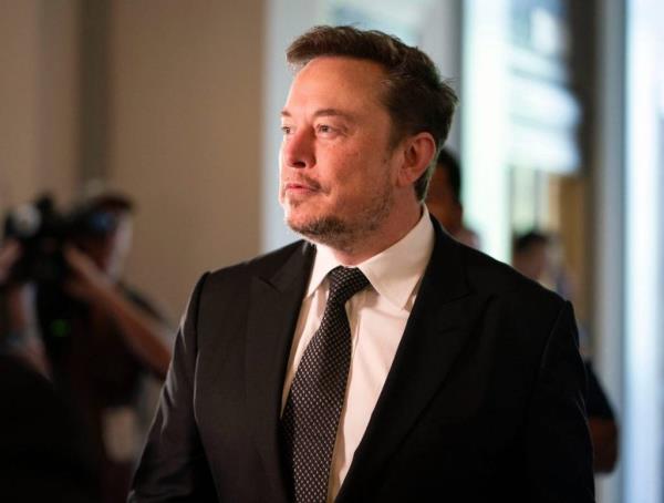 Elon Musk, CEO of X and Tesla, in a suit and tie, arriving at the Inaugural Artificial Intelligence Insight Forum on Dec. 5, 2025