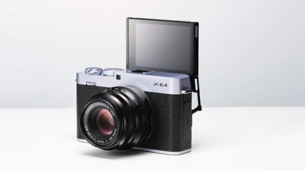 Fujifilm X-E4 with the screen flipped out on white background