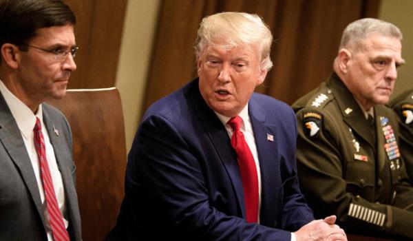 In this file photo taken on October 7, 2019 US Secretary of Defense Mark Esper (L) and Chairman of the Joint Chiefs of Staff Army General Mark A. Milley (R) listen while US President Do<em></em>nald Trump speaks before a meeting with senior military leaders in the Cabinet Room of the White House in Washington DC. (AFP)