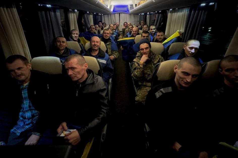 Ukrainian priso<em></em>ners of war (POWs) react on a bus after a swap, amid Russia's attack on Ukraine, at an unknown location in Ukraine.