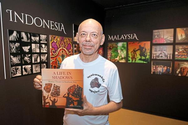 Korsovitis with his book A Life In Shadows, docu<em></em>menting South-East Asia’s shadow theatre traditions. Photo: The Star/Faihan Ghani